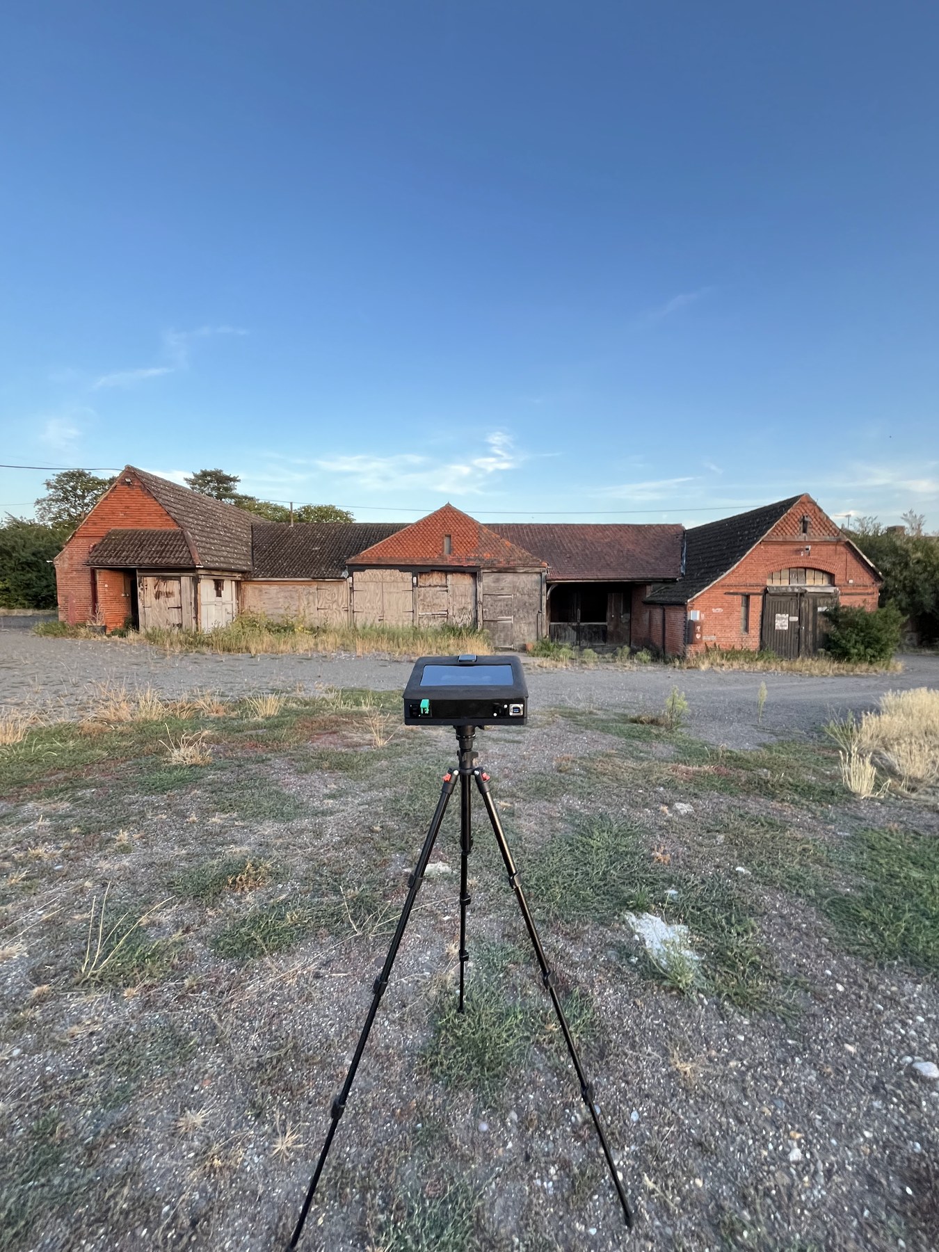 DarkFlight on a tripod facing farm buildings