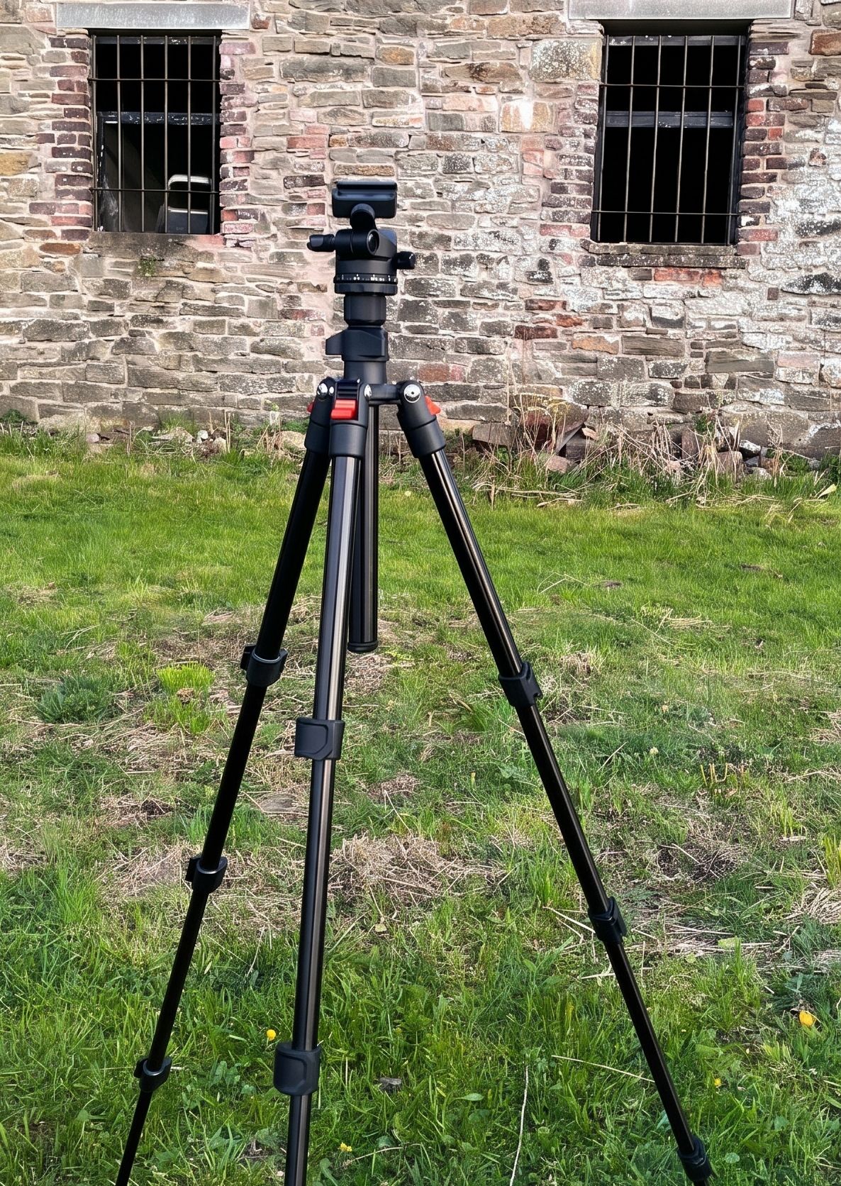 A tripod set down at the survey location, ready for the unit